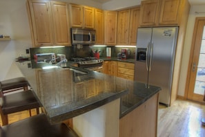 Modern kitchen with granite countertops.  