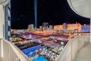 Wrap-around balcony with a great Las Vegas Strip view and overlooking the pool.