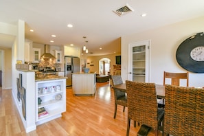 Dining and kitchen area are adjacent to the living room. 