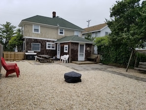 Backyard  (firepit, picnic table, swing, outdoor shower, fenced in yard)