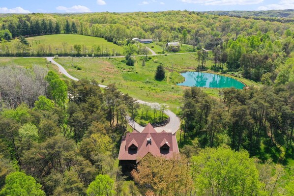 12 Private acres to explore including stocked fishing pond and basketball court.