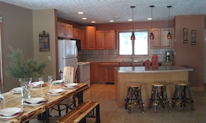 Kitchen & Dining Area-Log Table & Chairs comfortably seat 10 Plus 3 More at Bar
