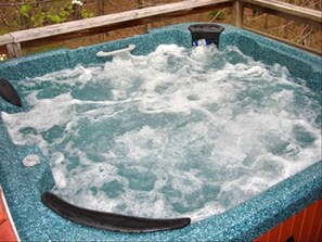 Treat yourself to a soak in the powerful 5-person hot tub with mountain views!