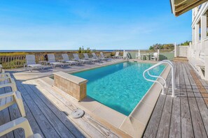 Lounge by the private saltwater pool underneath the sparkling blue sky.