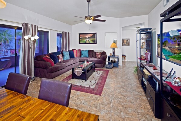 Formal living room with high ceilings and patio access!
