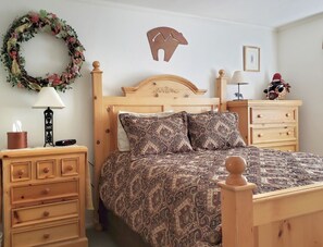 Cozy bedroom with brand new comforter set. Mountain view outside window.