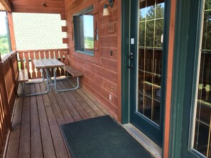 Main entrance, 
one of two picnic tables.