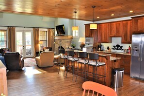 Fully equipped kitchen with ample storage; island seats 4. Granite countertops