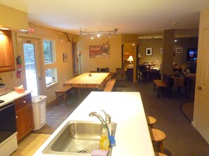 Mid level kitchen, dining area and main living room in back. All of you together