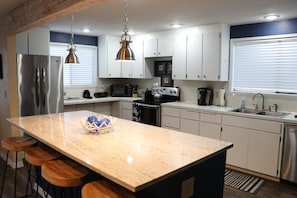 Spacious kitchen with beautiful granite island