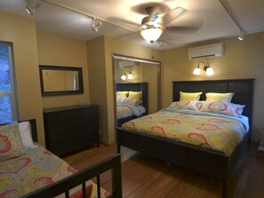 Main level bedroom with king and day bed, large closet, and remote AC/heat controls