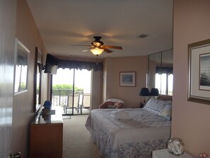 Master bedroom with king bed. Sleep to the sounds of the ocean in your backyard.