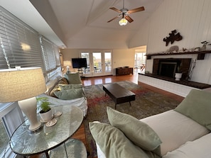 The vaulted ceilings give the living room  an open feeling. 