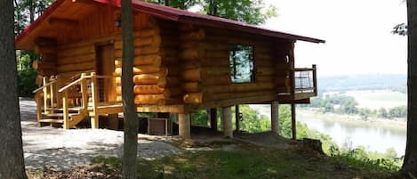 The Hawk's Nest is a hand-crafted log cabin overlooking the Ohio River.
