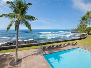 Relax by the private ocean front pool with comfy lounge chairs