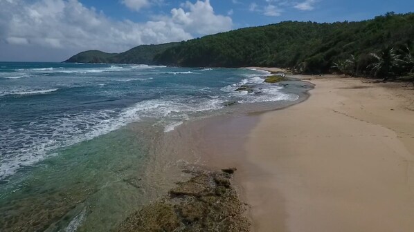 Soft white sand beach in  front of the property