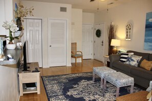 Full sized washer and dryer in the laundry room behind the louvered door.