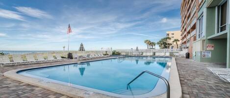 View of pool area, includes 10 person hot tub