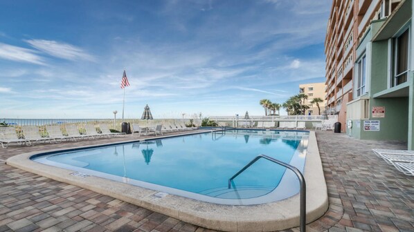 View of pool area, includes 10 person hot tub