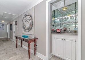 Entry way & bar area with wine glasses and blender!
