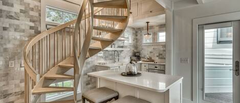 Spiral Staircase, Lower Level Kitchen with Bar and Stools.