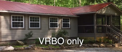 Guest House exterior - shows part of large screened-in porch
