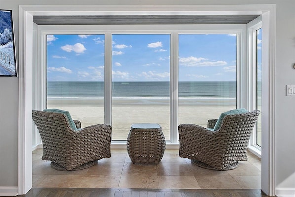 Relax in the sun room - a favorite of all our guests!  So close to the ocean!