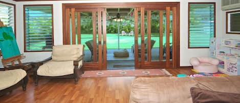 Large family/tv room opens into huge back yard.