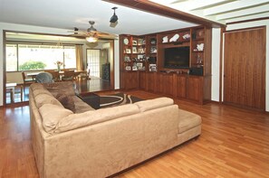 Large family/tv room going into dining room.