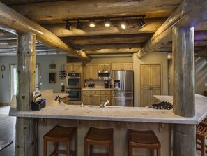 Chef's Kitchen fully stocked for cooks of all levels with barstool seating for 6