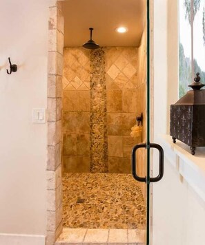 Feel like pampering yourself? Step into the enormous tiled shower in the master bath! Its unique rainfall shower head will make cleanup a relaxing experience.