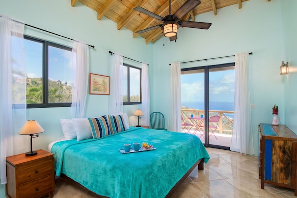 The master bedroom has its own balcony and enjoys amazing ocean views.