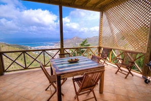 Enjoy the covered verandah with views of Road Town and the ocean.