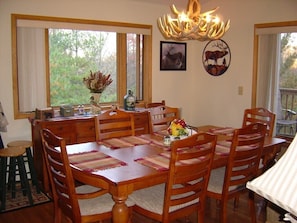 Dining Room (sits up to 10) with mountain view out the windows + bar stools  