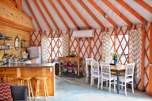 Furnished kitchen with table seating for 6 and bar seating for 2
