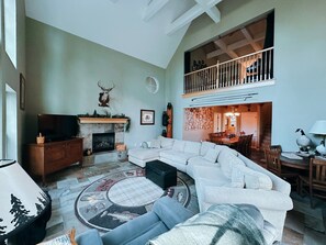 A large living room fit for game nights, movies, and happy hour.