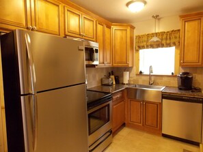 Kitchen - full size appliances, granite countertops, farmhouse sink and keurig.
