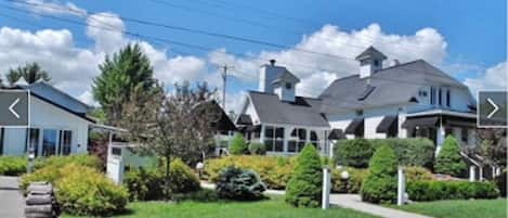 White Fence Main House and Carriage House on the left.