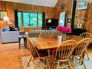 The 6' dining table is a gathering place between the kitchen and living room  