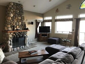 Great room with fireplace, TV and amazing views