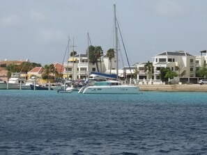 Club Nautico complex viewed from the water . 
ItRainsFishes  in the middle .
