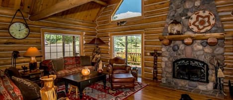 Living area, open to the dining area to the right of the fireplace