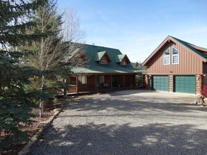 Front of the house and additional living/sleeping area is above the garage