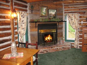 Living room | enjoy cozy fireside setting in this high vaulted great room.