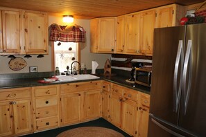 Kitchen | open, spacious with refrigerator, freezer, and microwave.
