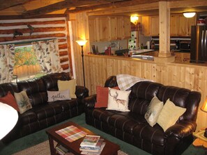 Living room | spacious, opens to the kitchen, couch ends extend.