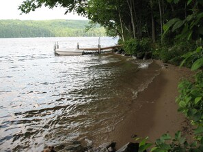 200' private shore w/ 80' sandy beach and dock on 8 mile long lake