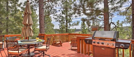 Very large deck surrounded by huge trees, wonderful mountain and village views