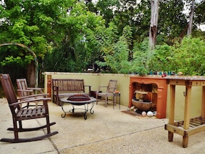 Grand patio with "sunken garden" feel, fire pit, outdoor dining and fountain