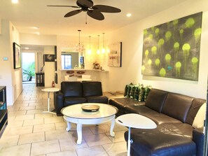 Lots of seating, dining & kitchen beyond, in this beautifully laid out space.